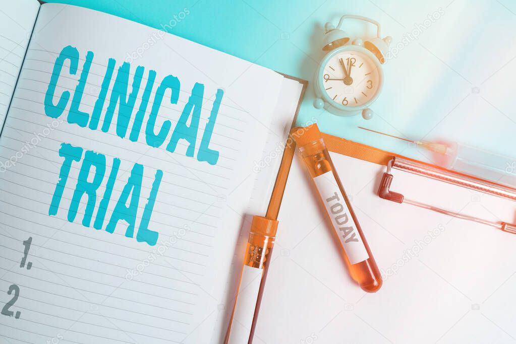 Writing note showing Clinical Trial. Business photo showcasing evaluate the effectiveness and safety of medications Blood sample vial medical accessories ready for examination.