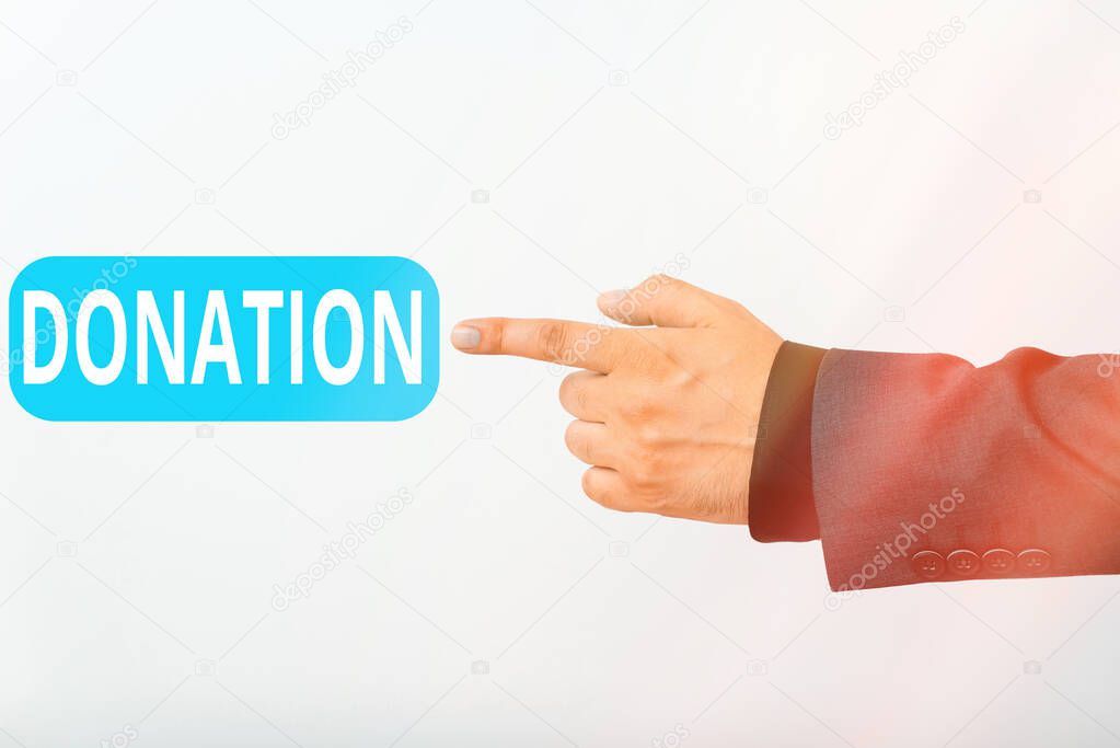 Text sign showing Donation. Conceptual photo the act or an instance of donating such as the making of a gift Model with pointing hand finger symbolizing navigation progress growth.