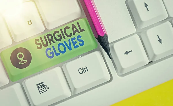 Handwriting text writing Surgical Gloves. Concept meaning to protect from the exposure to infectious materials Different colored keyboard key with accessories arranged on empty copy space.