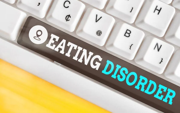 Word writing text Eating Disorder. Business concept for illnesses or severe disturbances in their eating behaviors Different colored keyboard key with accessories arranged on empty copy space. — Stock Photo, Image
