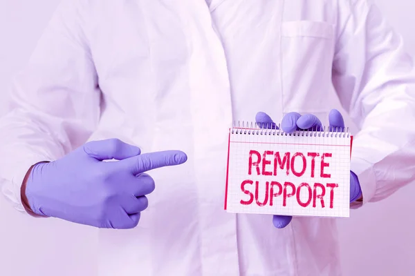 Writing note showing Remote Support. Business photo showcasing type of secure service, which permits representatives to help Laboratory Technician Featuring Sticker Paper Smartphone.
