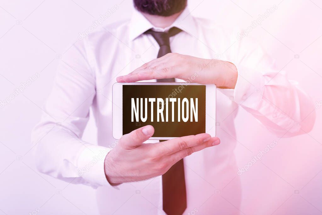 Writing note showing Nutrition. Business photo showcasing act or process of nourishing or being nourished by nutrients Model displaying black screen modern smartphone mock-up.