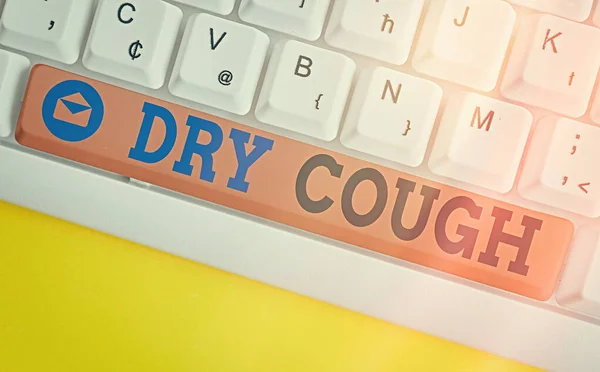 Conceptual hand writing showing Dry Cough. Business photo showcasing cough that are not accompanied by phlegm production or mucus Colored keyboard key with accessories arranged on copy space. — Stock Photo, Image