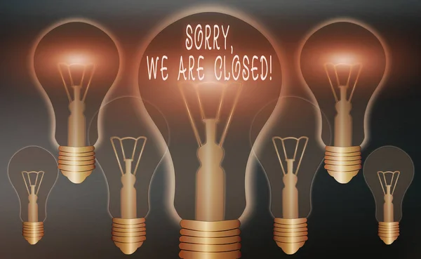 Conceptual hand writing showing Sorry, We Are Closed. Business photo showcasing apologize for shutting off business for specific time Realistic colored vintage light bulbs, idea sign solution. — Stock Photo, Image