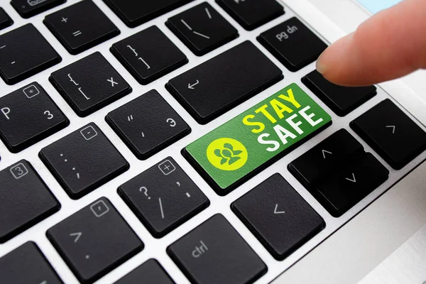 Writing note showing Stay Safe. Business photo showcasing secure from threat of danger, harm or place to keep articles Different Colored PC keyboard key With Accessories on Empty background.