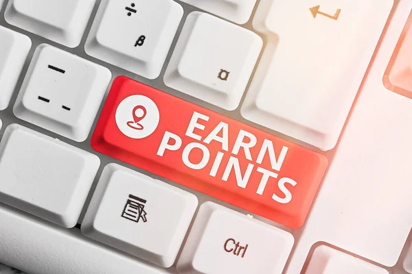 Text sign showing Earn Points. Conceptual photo getting praise or approval for something you have done Different colored keyboard key with accessories arranged on empty copy space.