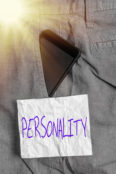 Text sign showing Personality. Conceptual photo the condition or fact of relating to a particular an individual Smartphone device inside formal work trousers front pocket near note paper. — Stock Photo, Image