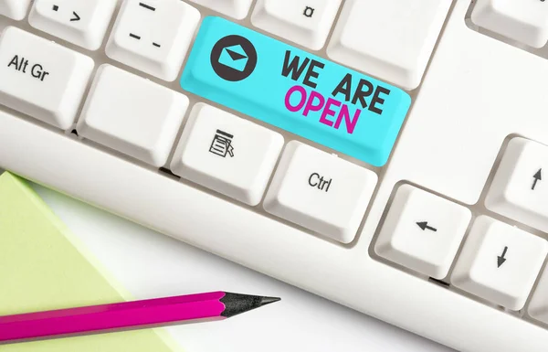 Handwriting text We Are Open. Concept meaning no enclosing or confining barrier, accessible on all sides Different colored keyboard key with accessories arranged on empty copy space. — Stock Photo, Image