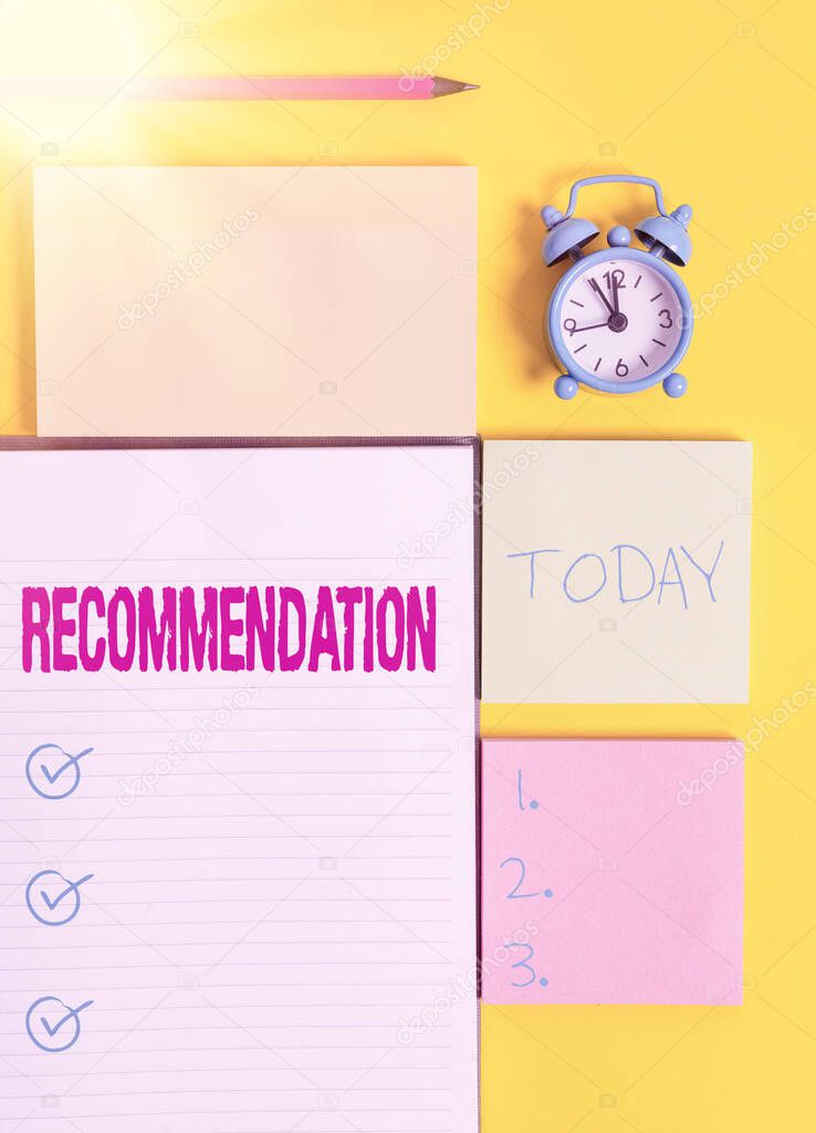 Text sign showing Recommendation. Conceptual photo something that recommends or expresses commendation Colored empty papers with copy space on the yellow background table.