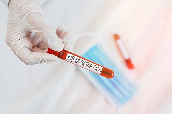 Signo de texto que muestra Descripción del trabajo. Foto conceptual: un relato formal de las responsabilidades de un empleado Vial de muestra de sangre extraída listo para un examen de diagnóstico médico. —  Fotos de Stock