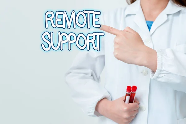 Writing note showing Remote Support. Business photo showcasing type of secure service, which permits representatives to help Empty sticker paper accessories smartphone with medical gloves on.