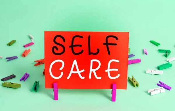 Text sign showing Self Care. Conceptual photo the practice of taking action to preserve or improve one s is health Colored crumpled rectangle shaped reminder paper light blue background. — Stock Photo, Image