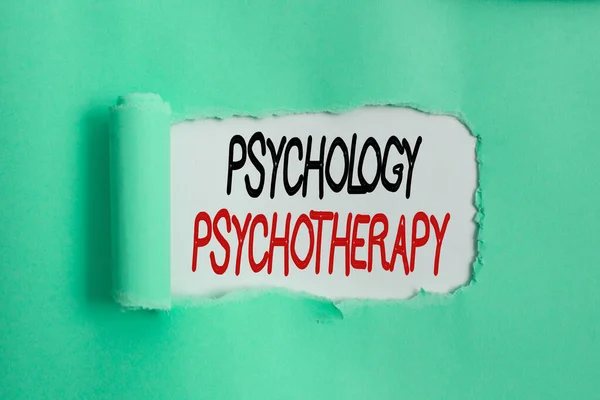Writing note showing Psychology Psychotherapy. Business photo showcasing use of a psychological method to treat mental illness Rolled ripped torn cardboard above a wooden classic table. — Stock Photo, Image