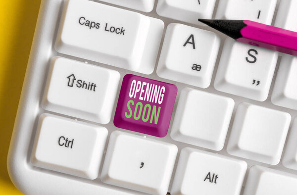 Text sign showing Opening Soon. Conceptual photo Going to be available or accessible in public anytime shortly Different colored keyboard key with accessories arranged on empty copy space.