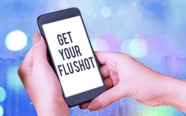 Kelime yazma metni Grip aşını ol. Aşılama için iş konsepti, renkli bokeh arkaplan altında beyaz ekranlı gribe karşı korunmak için her yıl verilir..