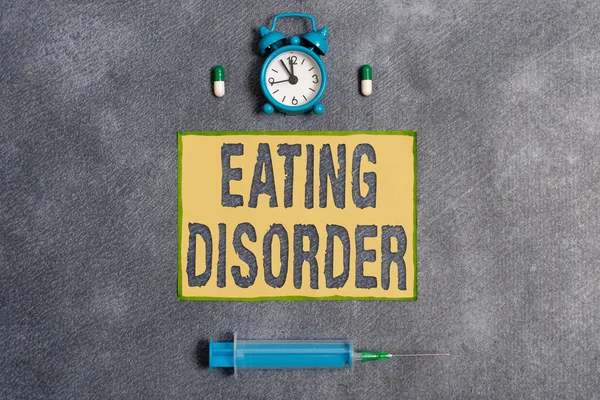 Word writing text Eating Disorder. Business concept for illnesses or severe disturbances in their eating behaviors Set of medical equipment with notepad for health condition assessment. — Stock Photo, Image