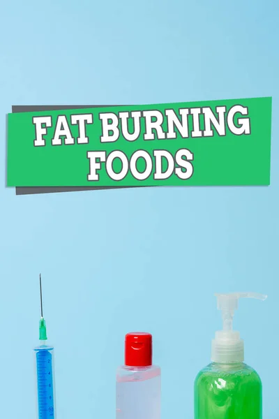 Word writing text Fat Burning Foods. Business concept for produce fat loss by stimulating metabolism to reduce appetite Primary medical precautionary equipments for health care protection. — Stock Photo, Image