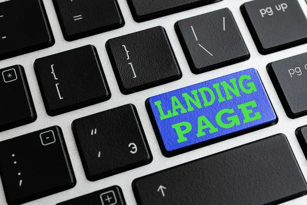 Text sign showing Landing Page. Conceptual photo Website accessed by clicking a link on another web page Different Colored PC keyboard key With Accessories on Empty background. — Stock Photo, Image