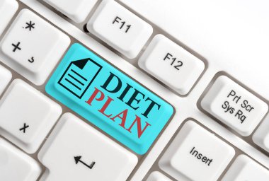 Kelime yazma diyet planı. Belirli bir kilo elde etmek için iş konsepti planlanır boş fotokopi alanındaki aksesuarlarla farklı renklerde klavye anahtarı.