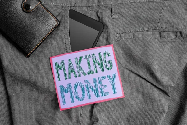 Handstil text tjäna pengar. Begreppet mening Att ge möjlighet att göra en vinst Tjäna ekonomiskt stöd Smartphone enhet inne byxor framficka med plånbok och anteckningspapper. — Stockfoto