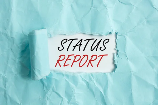 Text sign showing Status Report. Conceptual photo summarizes the particular situation as of a stated period Rolled ripped torn cardboard placed above a wooden classic table backdrop. — Stock Photo, Image