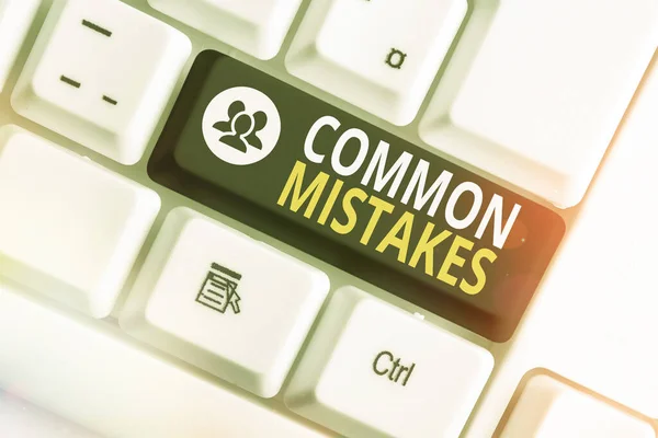 Writing note showing Common Mistakes. Business photo showcasing actions that are often used interchangeably with error Colored keyboard key with accessories arranged on empty copy space. — Stock Photo, Image