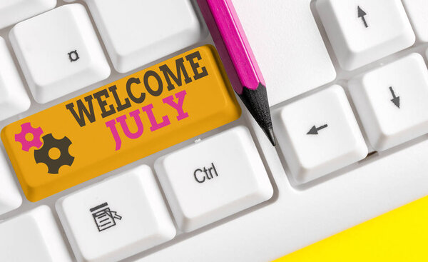 Writing note showing Welcome July. Business photo showcasing Calendar Seventh Month 31days Third Quarter New Season Colored keyboard key with accessories arranged on empty copy space.