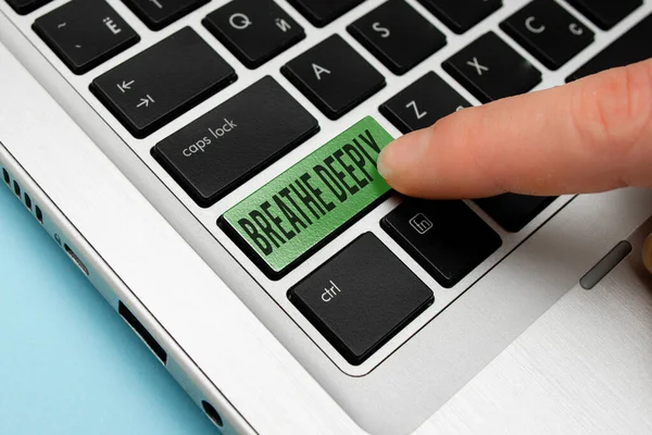 Text sign showing Breathe Deeply. Conceptual photo to take a lot of air into the lungs inhaleexhale fully Different Colored PC keyboard key With Accessories on Empty background.