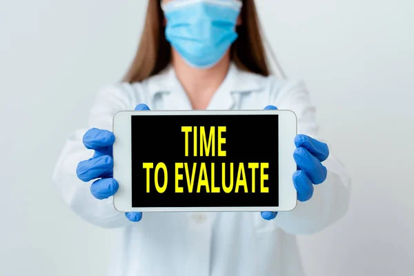 Handwriting text Time To Evaluate. Concept meaning judge something with respect to its worth or significance Laboratory technician featuring empty sticker paper accessories smartphone. — Stock Photo, Image