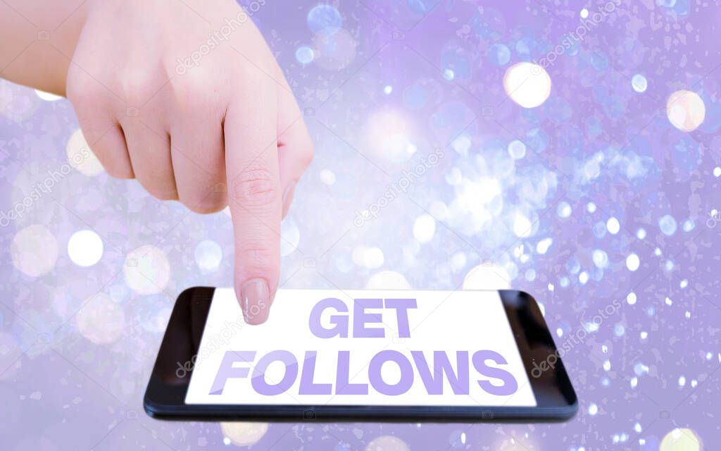 Text sign showing Get Follows. Conceptual photo an individual who imitates copies or takes as model ideal an individual Modern gadgets with white display screen under colorful bokeh background.