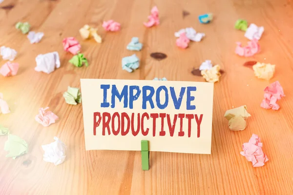 Konceptuell handstil som visar Förbättra produktiviteten. Business foto text för att öka maskinen och process effektivitet Färgade hopskrynklade papper trägolv bakgrund klädnypa. — Stockfoto