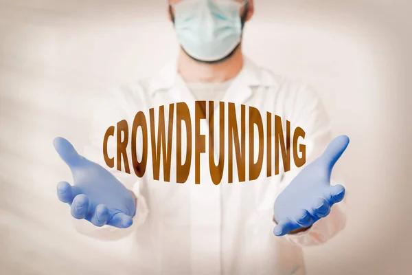 Handwriting text Crowdfunding. Concept meaning practice obtaining needed funding by soliciting contributions Laboratory Technician Featuring Empty Sticker Paper Accessories Smartphone. — Stock Photo, Image
