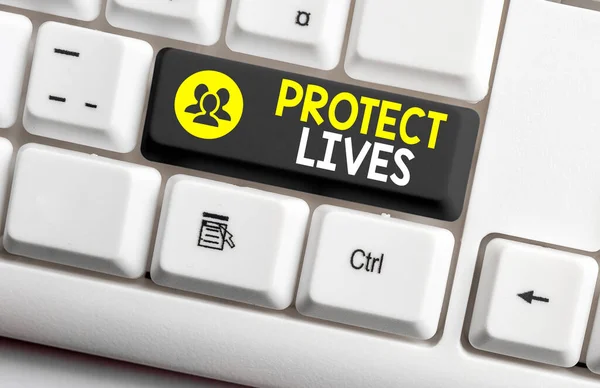 Writing note showing Protect Lives. Business photo showcasing to cover or shield from exposure injury damage or destruction Colored keyboard key with accessories arranged on empty copy space. — Stock Photo, Image