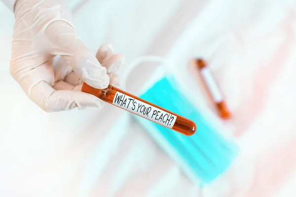 Text sign showing What S Is Your Peach question. Conceptual photo an exceptionally good an individual or thing Extracted blood sample vial ready for medical diagnostic examination.