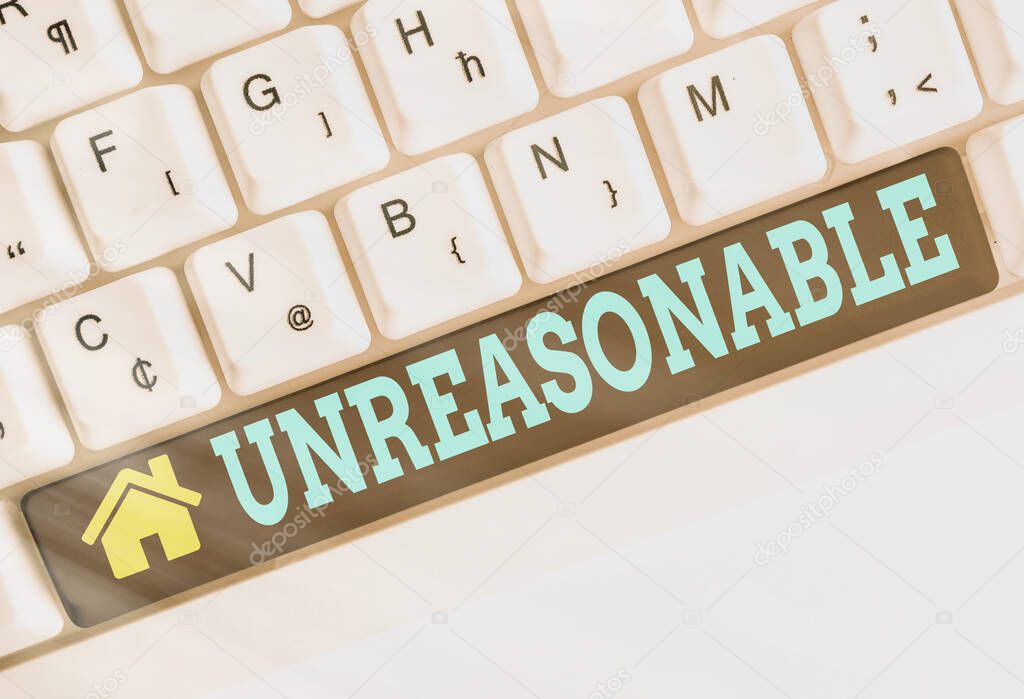 Text sign showing Unreasonable. Conceptual photo not conformable to reason or exceeding the bounds of reason Different colored keyboard key with accessories arranged on empty copy space.