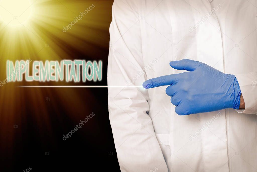 Conceptual hand writing showing Implementation. Business photo showcasing application of making something active or effective Displaying Sticker Paper Accessories With Medical Gloves On.