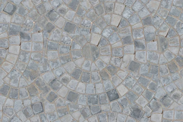 Kullersten cirkulärt mönster block trottoaren sömlös textur bakgrund. Ovanifrån — Stockfoto