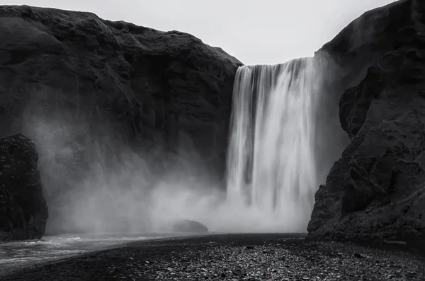 The Skogafoss waterfall in black and withe, Iceland. The Skogafoss is one of the biggest waterfalls in the country with a width of 25 metres (82 feet) and a drop of 60 m (200 ft)
