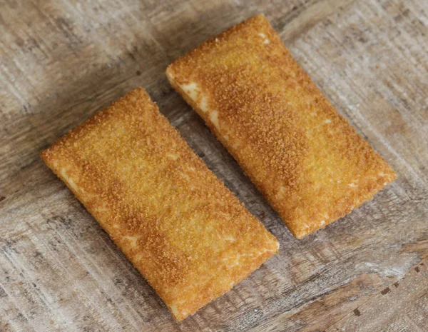 Kaassouffl��, a Dutch snack of melted cheese inside a thin dough-based wrap — Stok Foto