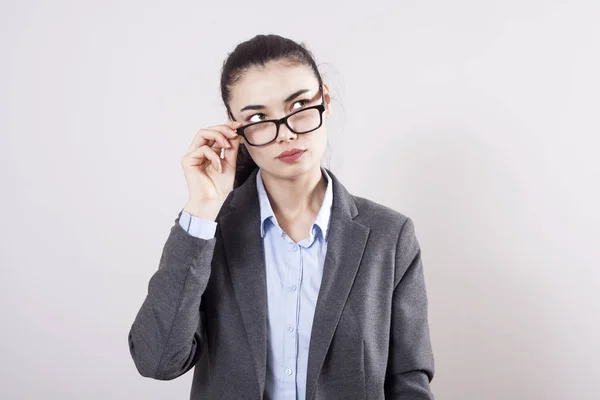 stock image Young businesswoman on gray background