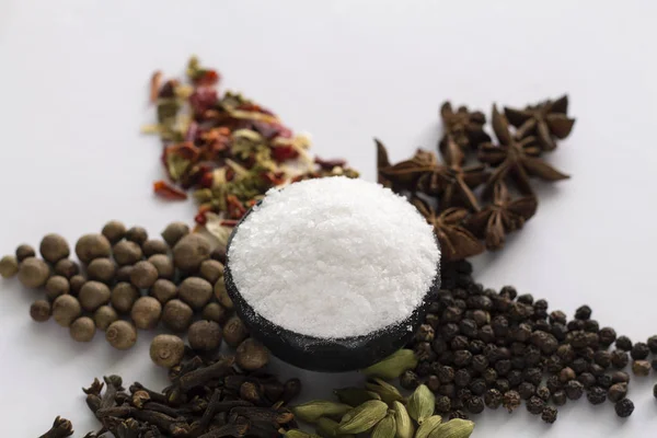 Various spices on white background.