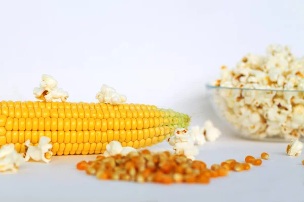 yellow corn and white popcorn on white background. grain of corn.