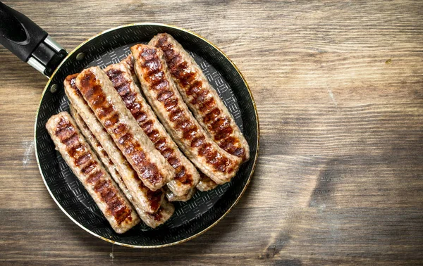Fried Sausages Frying Pan Wooden Table — Stock Photo, Image