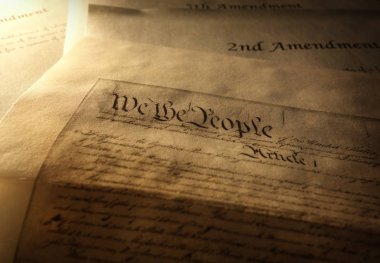 Article One of the US Constitution with 2nd and 5th Amendments in the background                                clipart