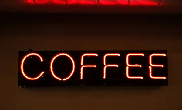 Red neon coffee sign in a cafe