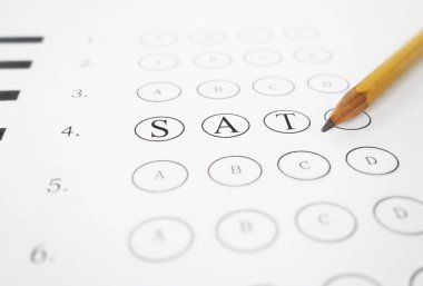 Closeup of multiple choice exam with SAT text and pencil clipart