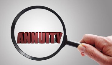Magnifying glass looking at Annuity text  clipart