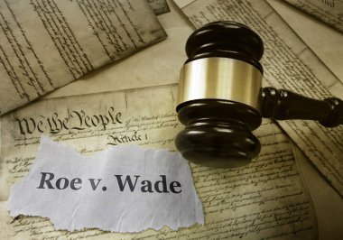 Roe v Wade news headline with gavel on a copy of the United States Constitution                               clipart