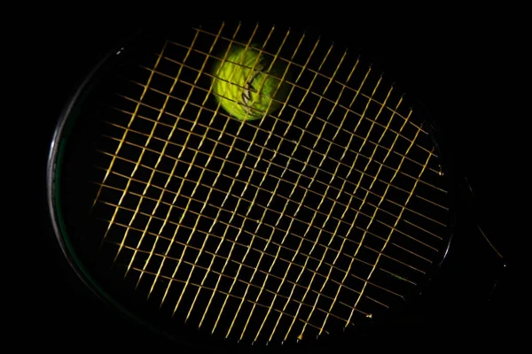 Tennis racket and ball on black — Stock Photo, Image