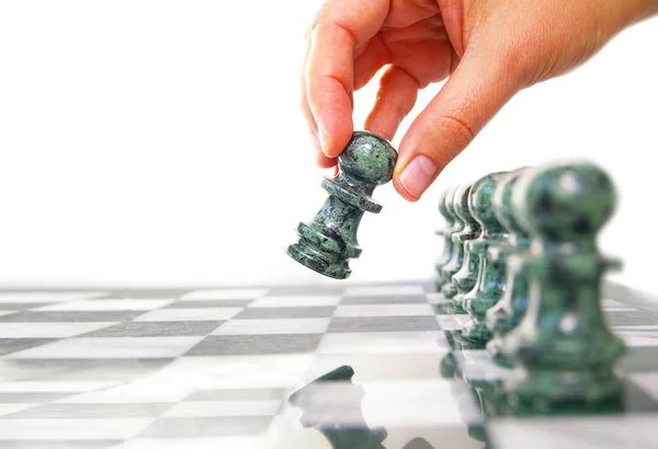 Woman moving a chess piece ahead — Stock Photo, Image